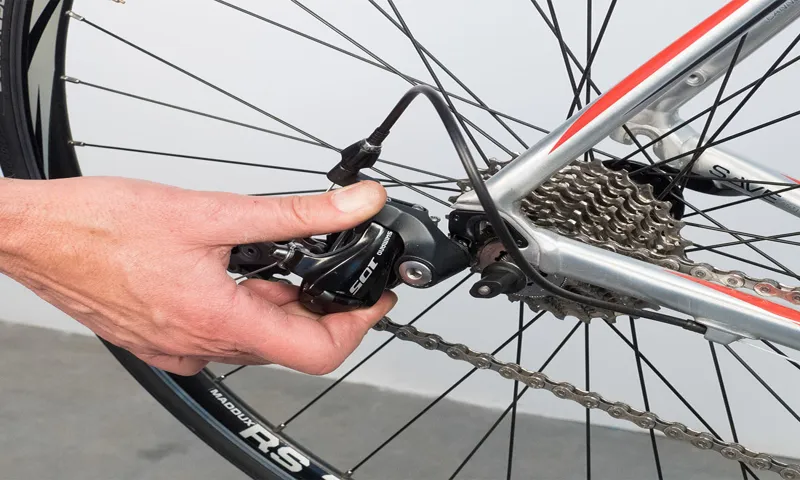 how to put a rear bike tire back on